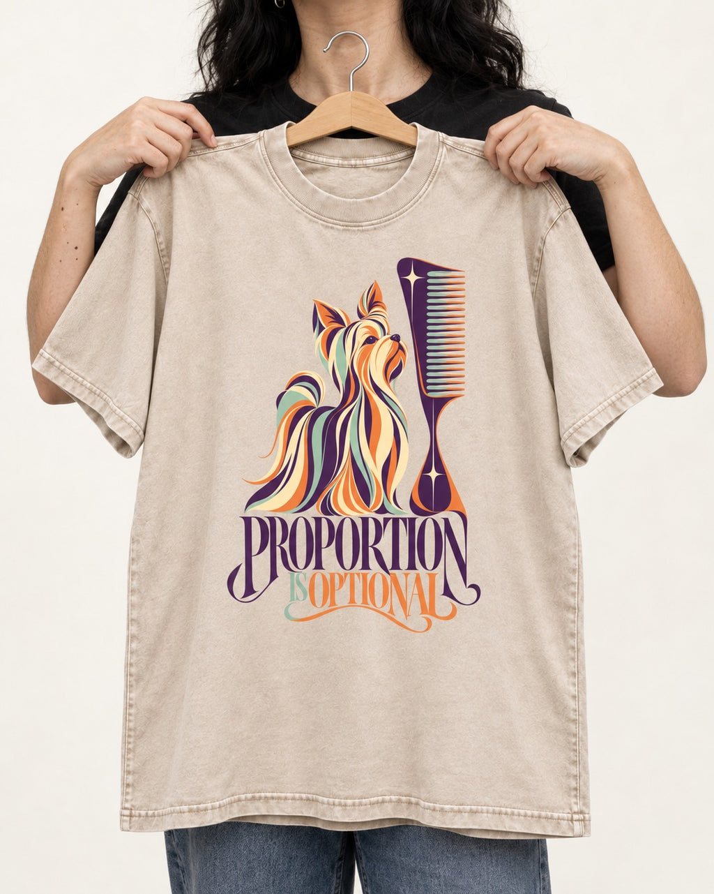 Yorkshire Terrier Proportion Is Optional Washed Tee in Apricot, held up on a hanger