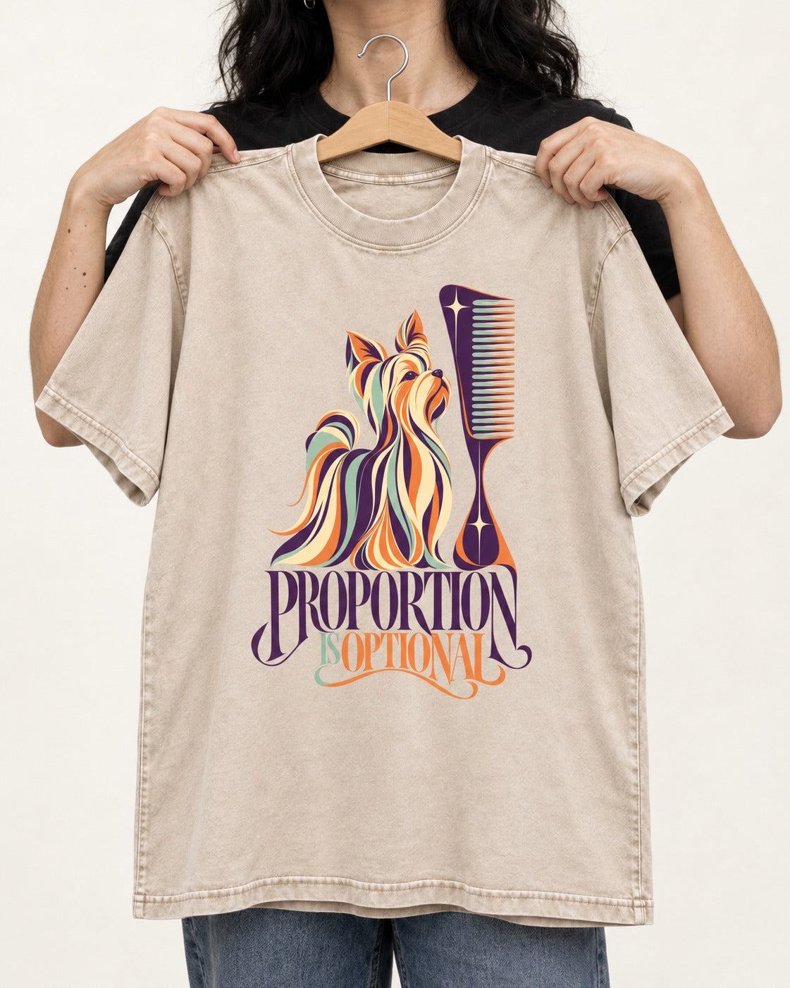 Yorkshire Terrier Proportion Is Optional Washed Tee in Apricot, held up on a hanger