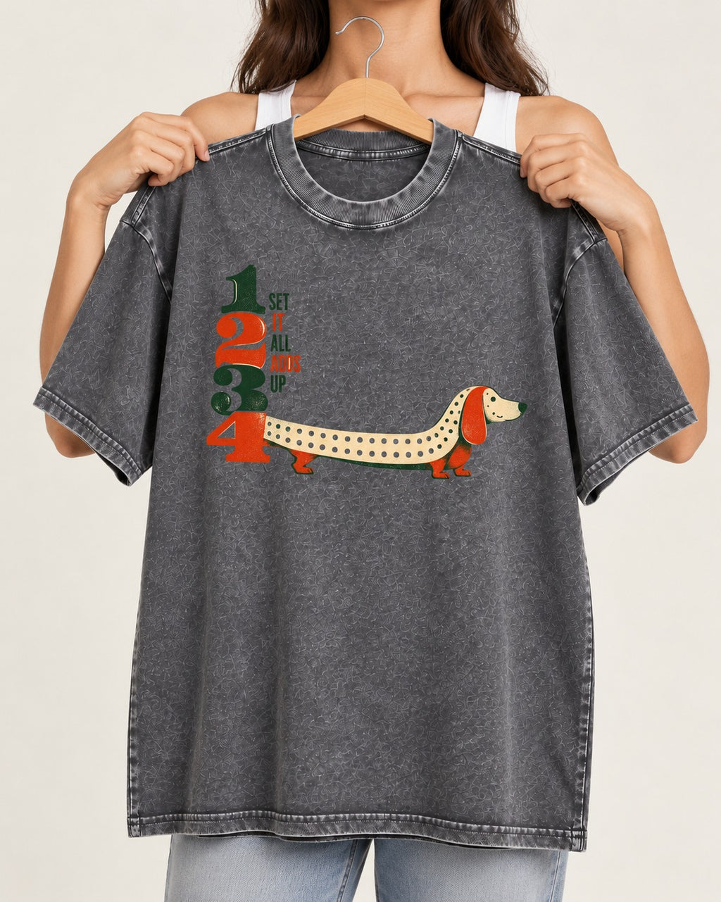 Dachshund Adds Up Washed Tee in Gray, held up on a hanger