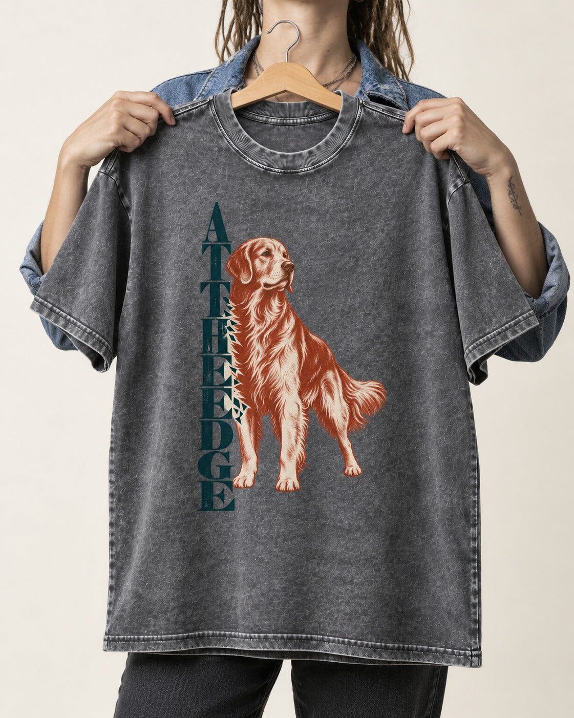 Golden Retriever At the Edge Washed Tee in Gray, held up on a hanger