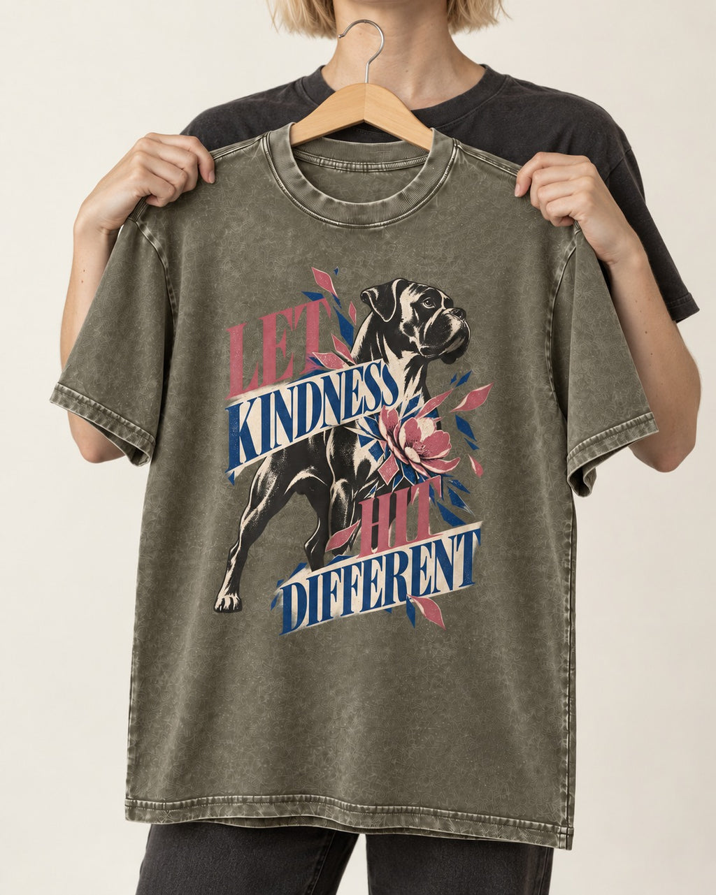 Let Kindness Hit Different Boxer Floral Collage Washed Tee in Army Green, held up on a hanger