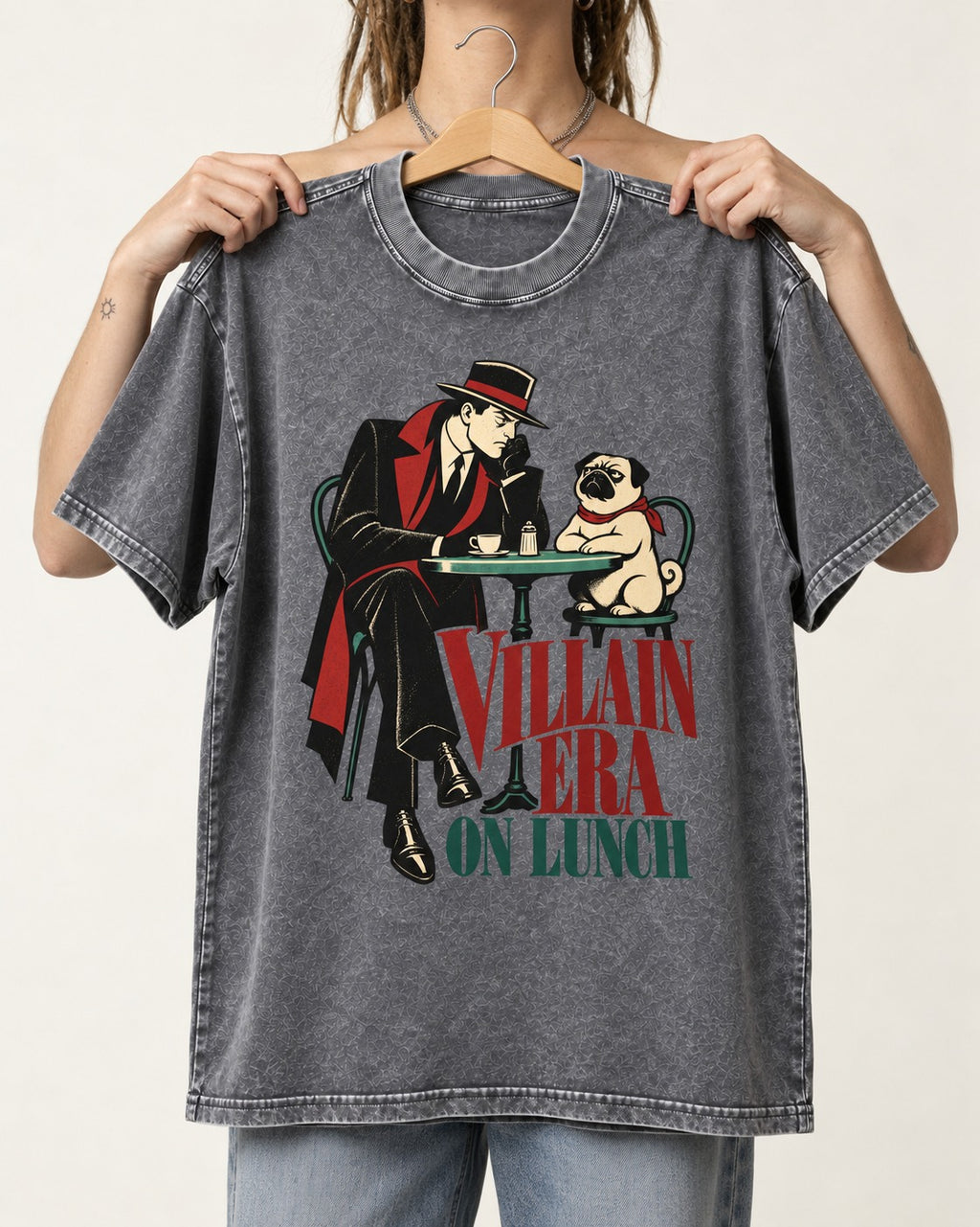 Pug Villain Era Washed Tee in Gray, held up on a hanger