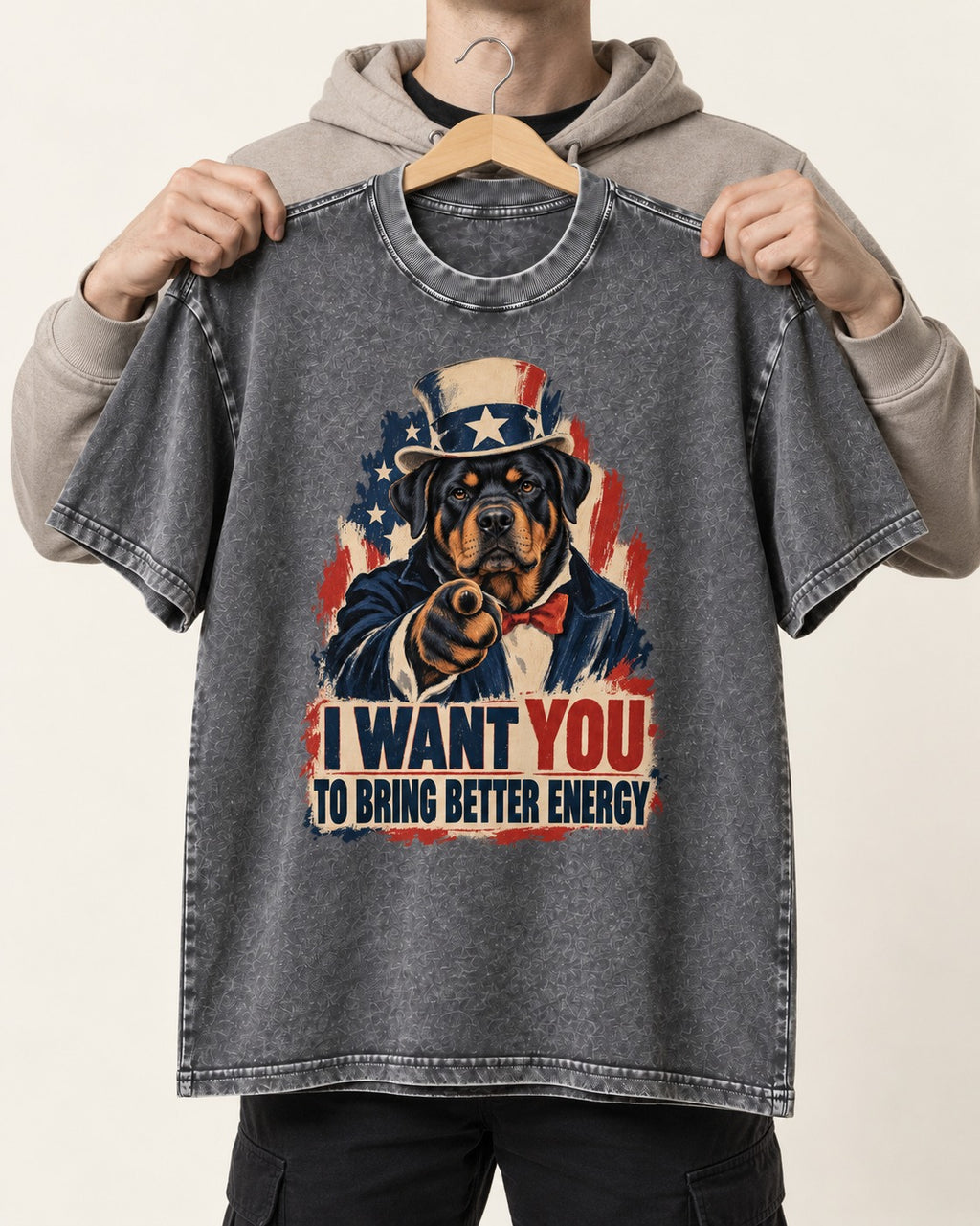 Rottweiler I Want You to Bring Better Energy Recruitment Poster Graphic Washed Tee in Gray, held up on a hanger