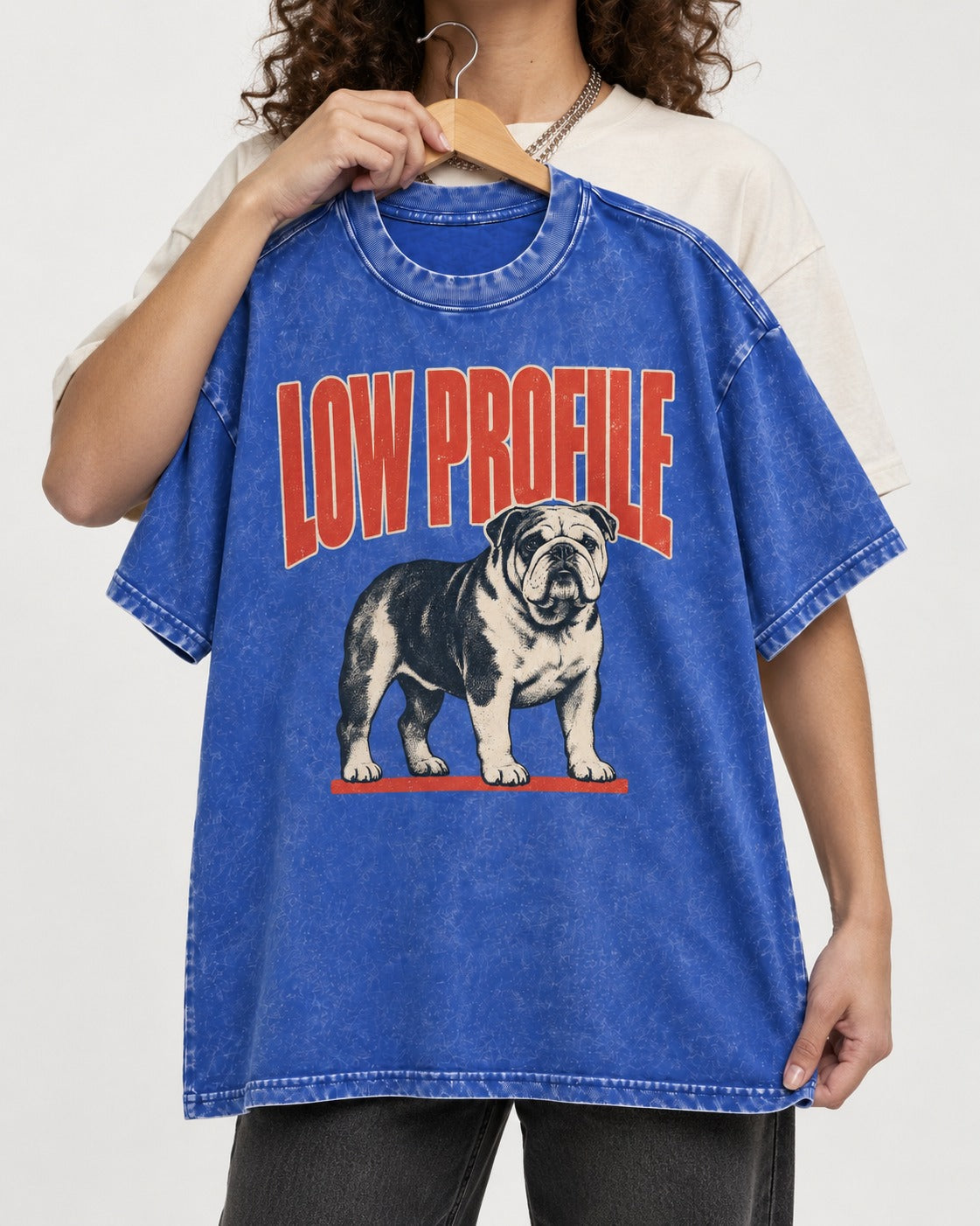 English Bulldog Low Profile Standing Graphic Washed Tee in Royal Blue, held up on a hanger
