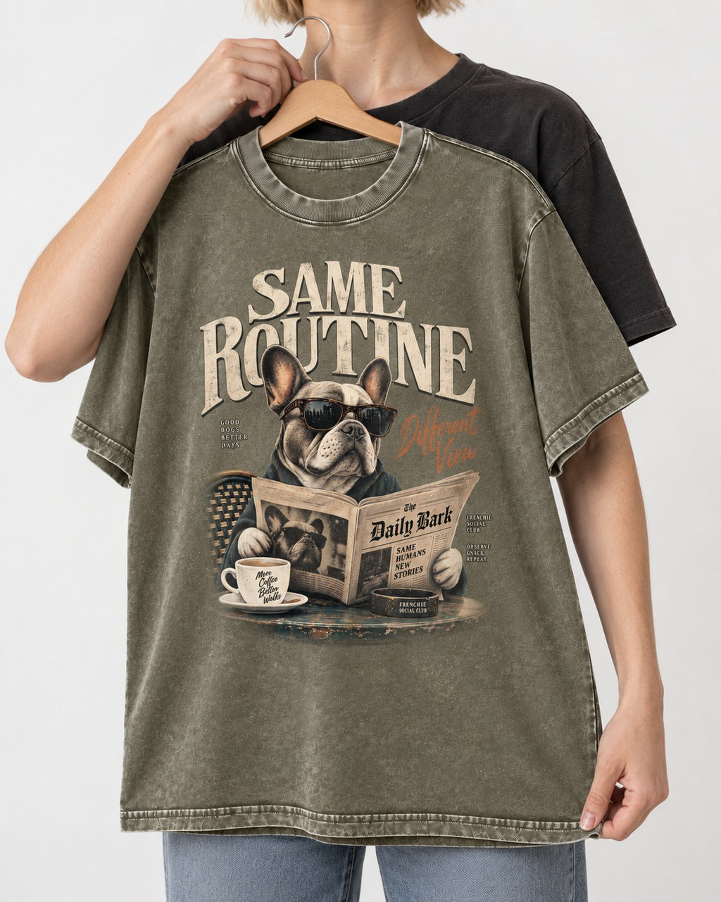 Frenchie Same Routine Different View Graphic Washed Tee in Army Green, held up on a hanger