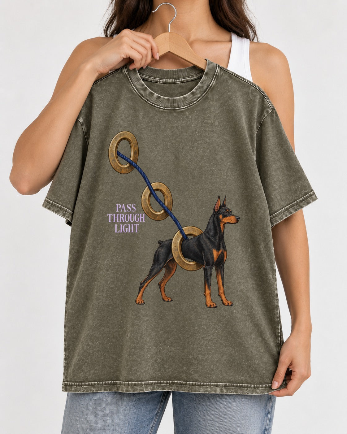 Doberman Pass Through Light Ring Graphic Washed Tee in Army Green, held up on a hanger