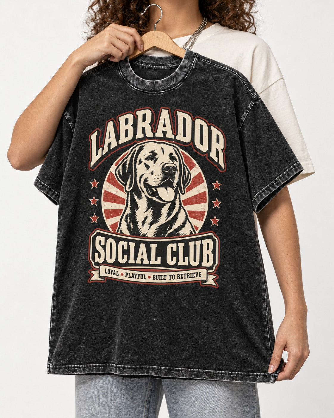 Labrador Retriever Social Club Loyal Playful Built to Retrieve Badge Graphic Washed Tee in Black, held up on a hanger