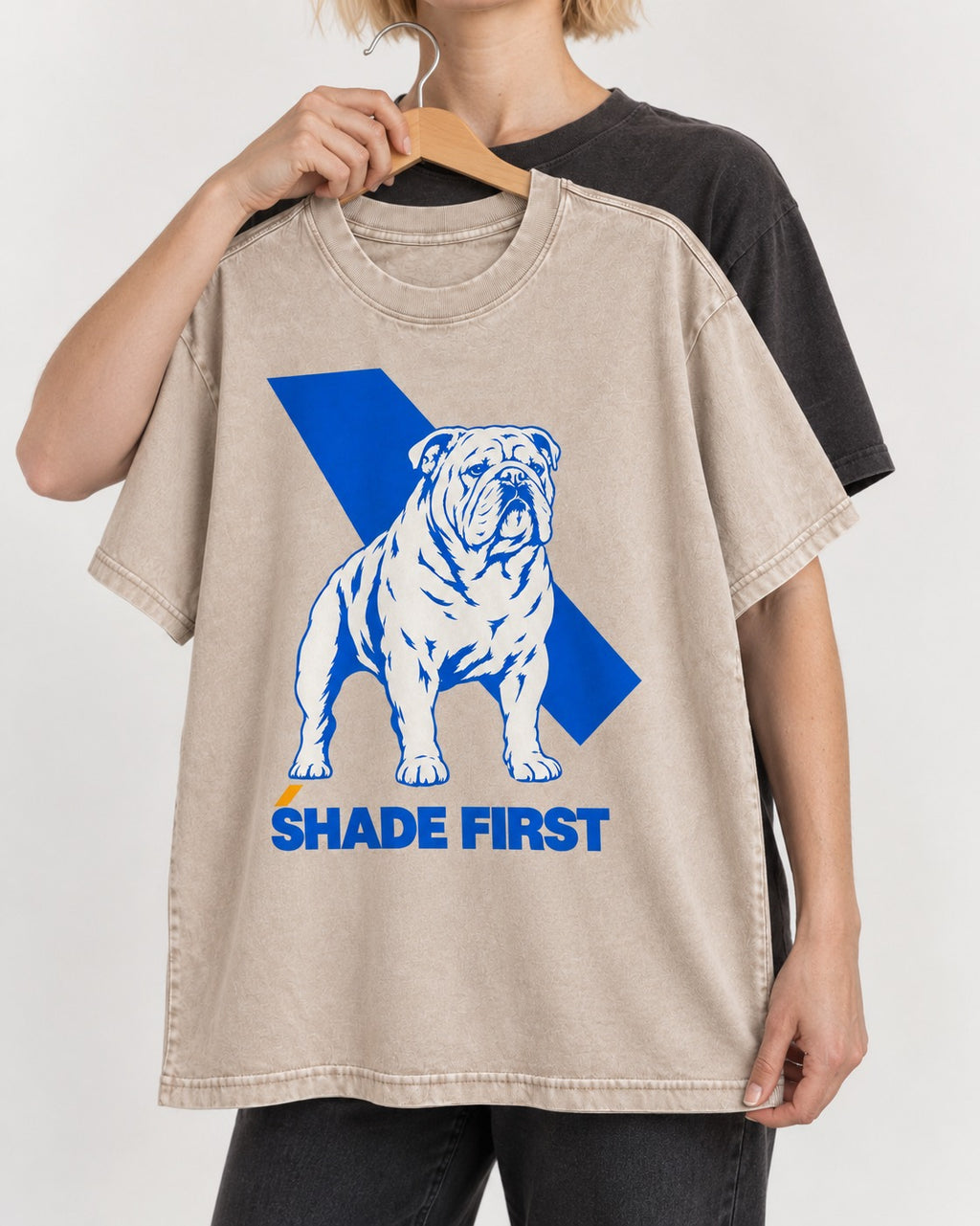 Shade First English Bulldog Washed Tee in Apricot, held up on a hanger