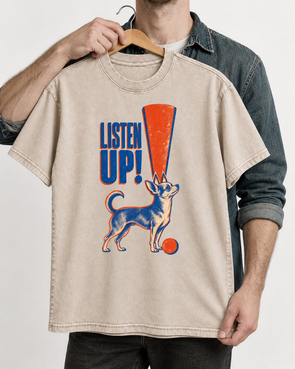 Listen Up Chihuahua Washed Tee in Apricot, held up on a hanger