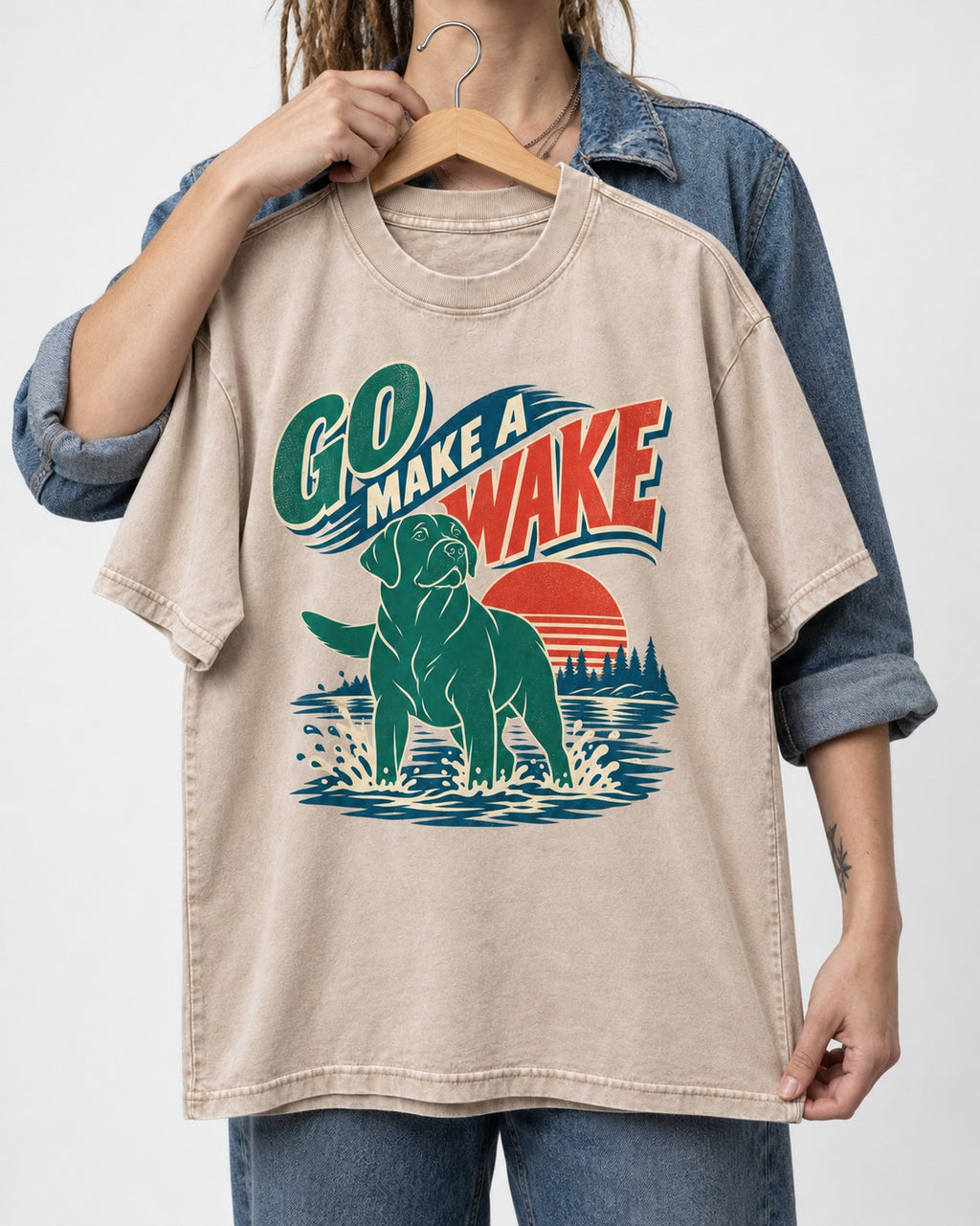 Labrador Retriever Go Make a Wake Lake Graphic Washed Tee in Apricot, held up on a hanger