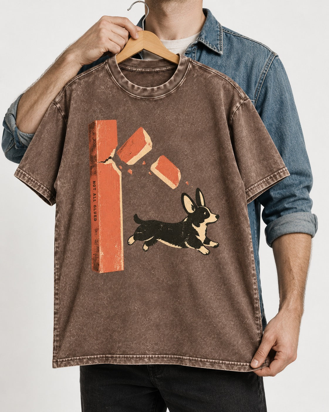 Not All Glued Corgi Washed Tee in Coffee, held up on a hanger