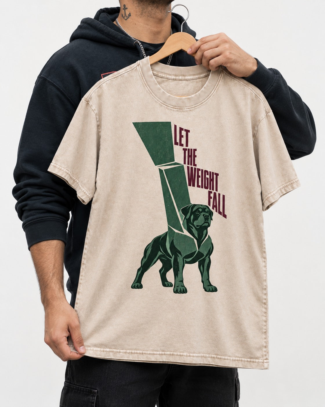 Let the Weight Fall Rottweiler Washed Tee in Apricot, held up on a hanger
