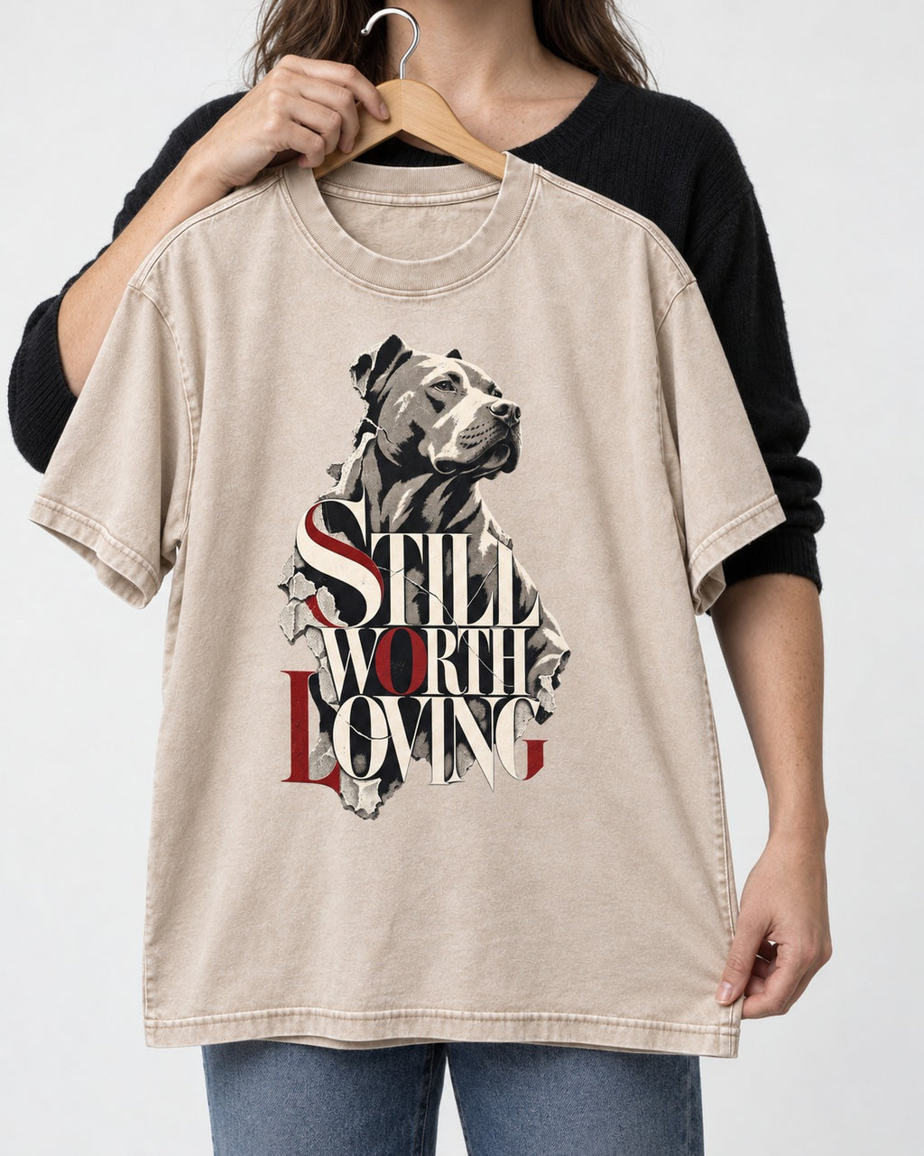 Pitbull Still Worth Loving Torn Poster Portrait Graphic Washed Tee in Apricot, held up on a hanger