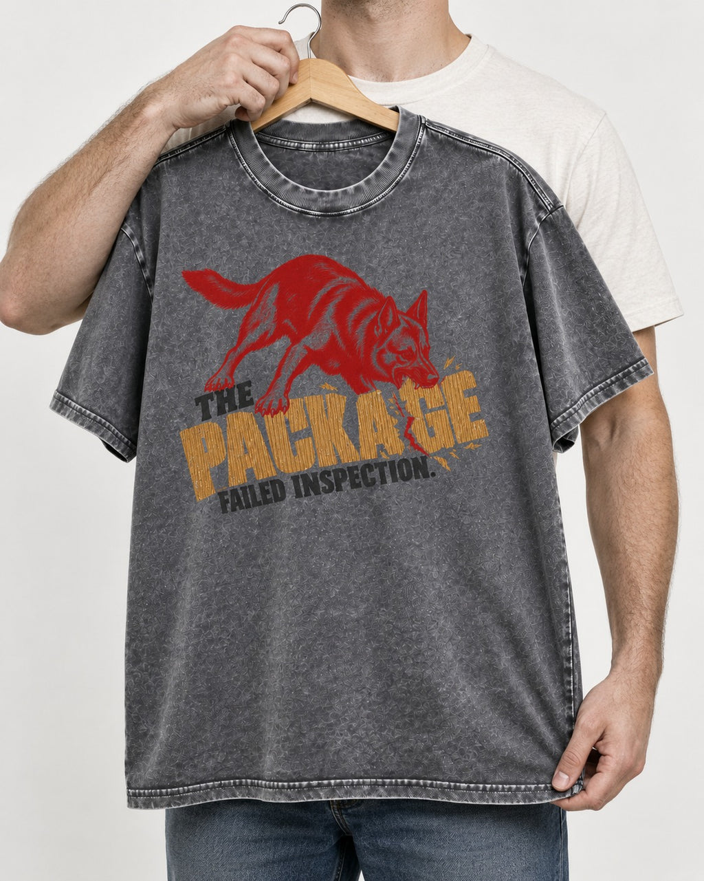 The Package Failed Inspection German Shepherd Dog Washed Tee in Gray, held up on a hanger