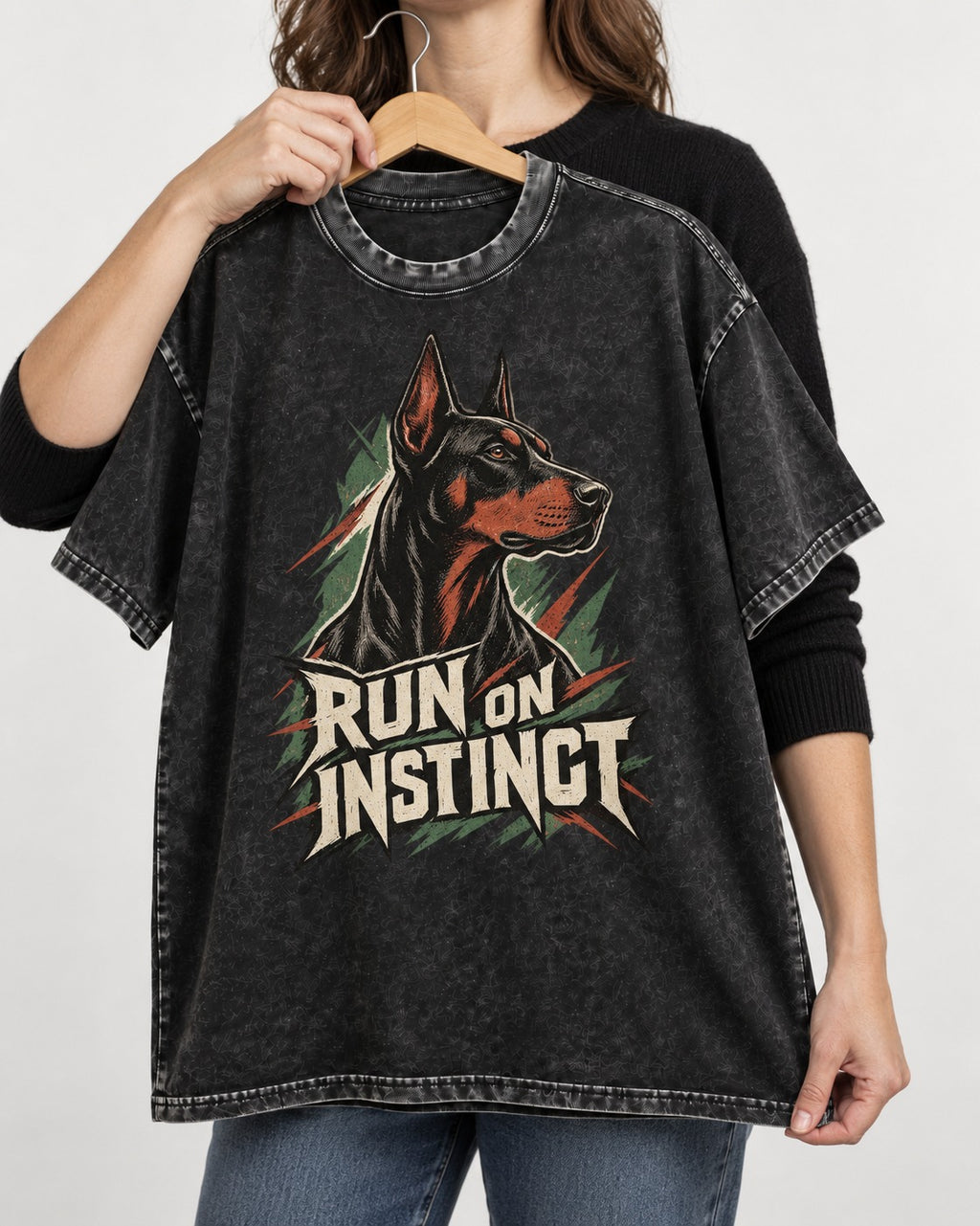 Doberman Run on Instinct Brush Slash Graphic Washed Tee in Black, held up on a hanger
