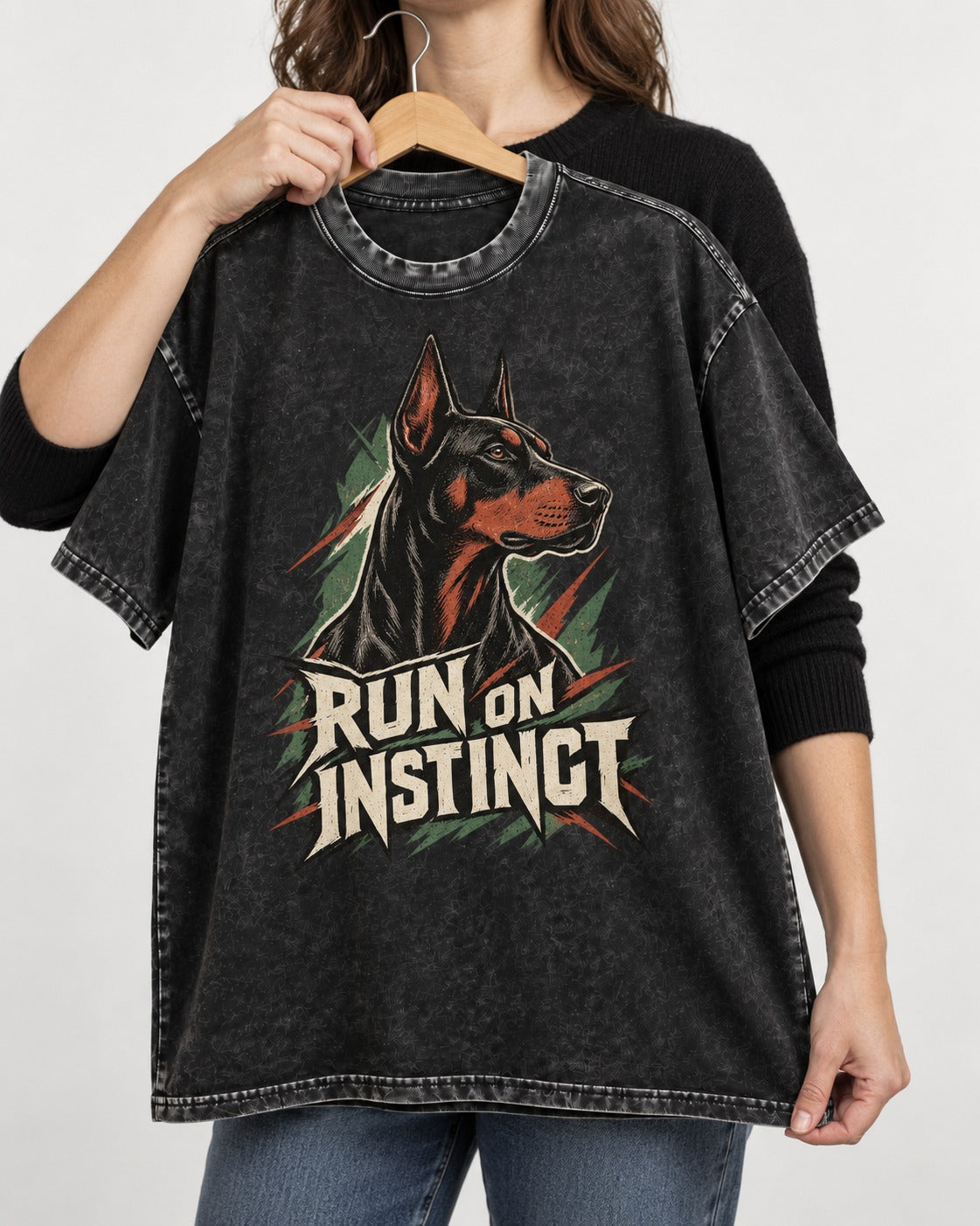 Doberman Run on Instinct Brush Slash Graphic Washed Tee in Black, held up on a hanger