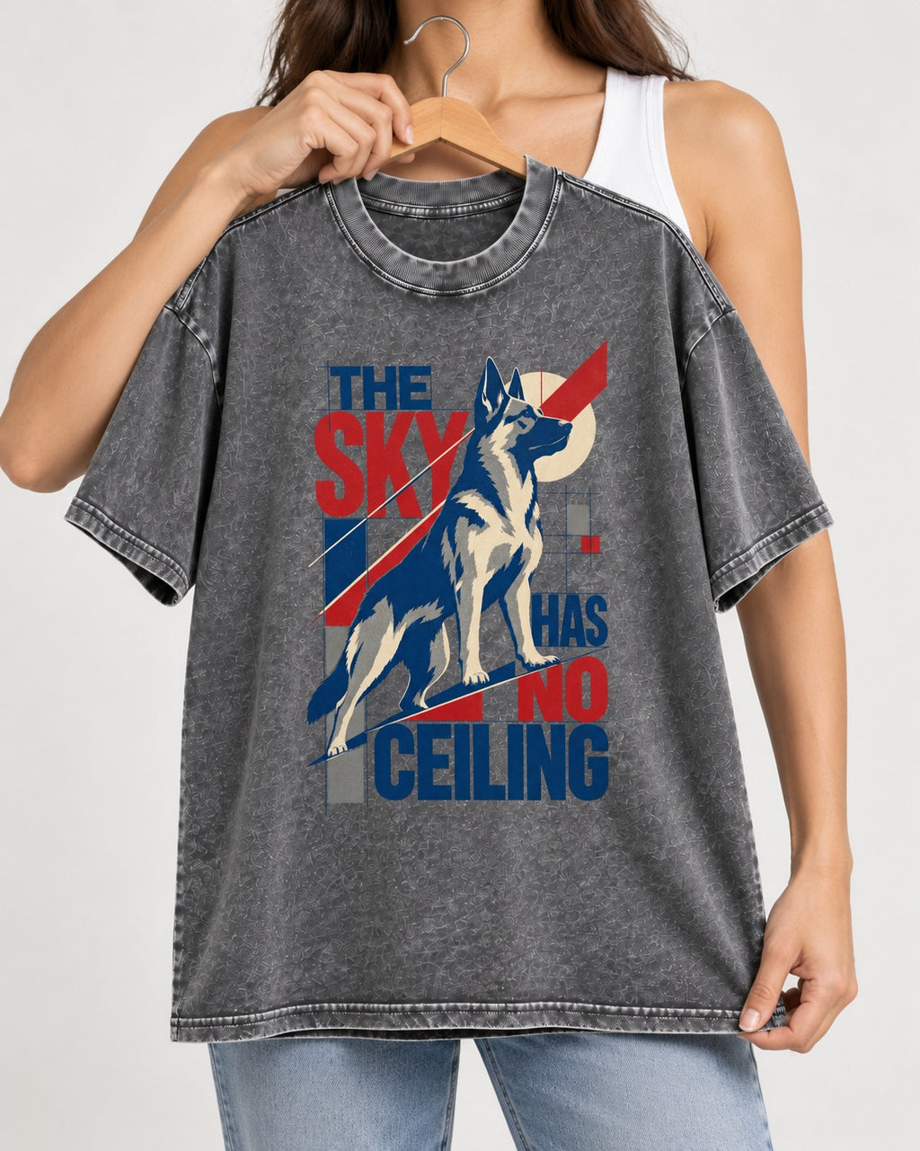 Sky Has No Ceiling German Shepherd Dog Washed Tee in Gray, held up on a hanger