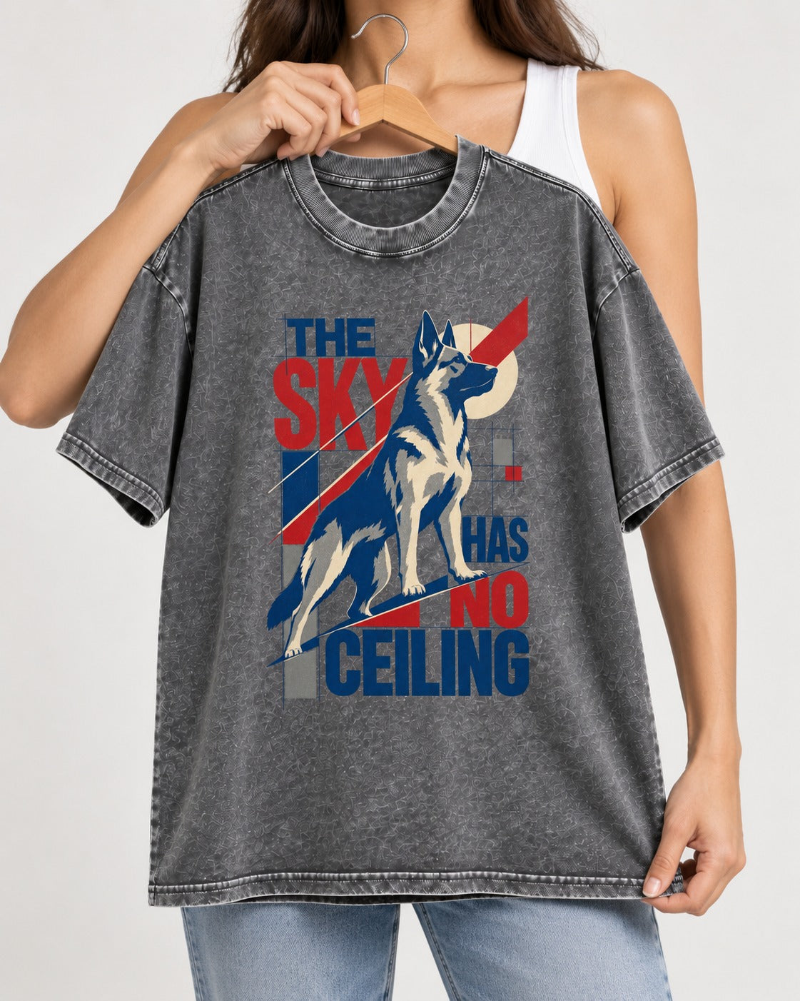 Sky Has No Ceiling German Shepherd Dog Washed Tee in Gray, held up on a hanger