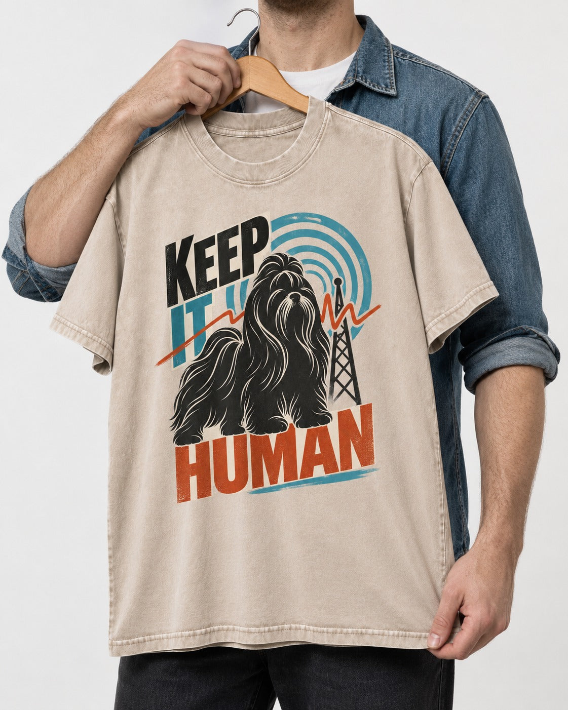 Shih Tzu Keep It Human Radio Signal Graphic Washed Tee in Apricot, held up on a hanger