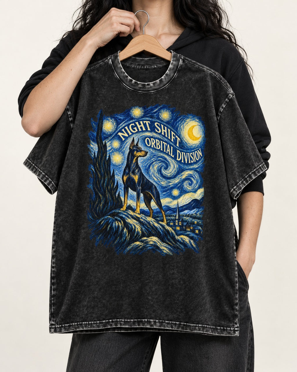 Doberman Night Shift Orbital Division Starry Night Graphic Washed Tee in Black, held up on a hanger