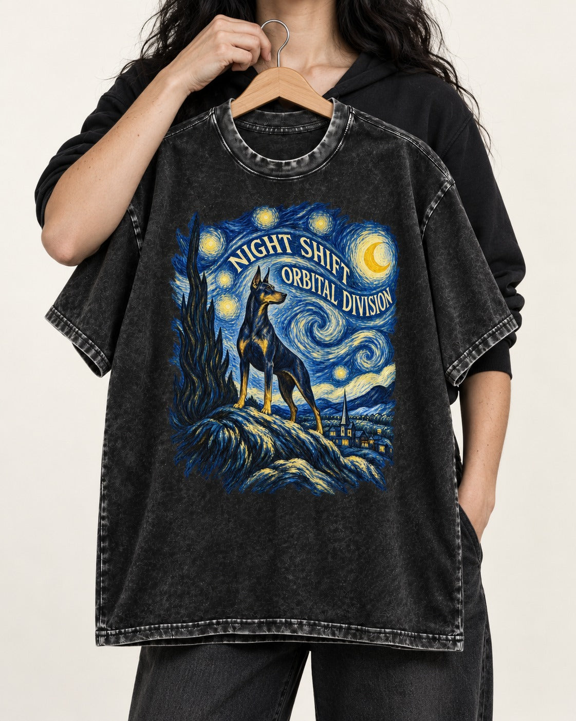 Doberman Night Shift Orbital Division Starry Night Graphic Washed Tee in Black, held up on a hanger