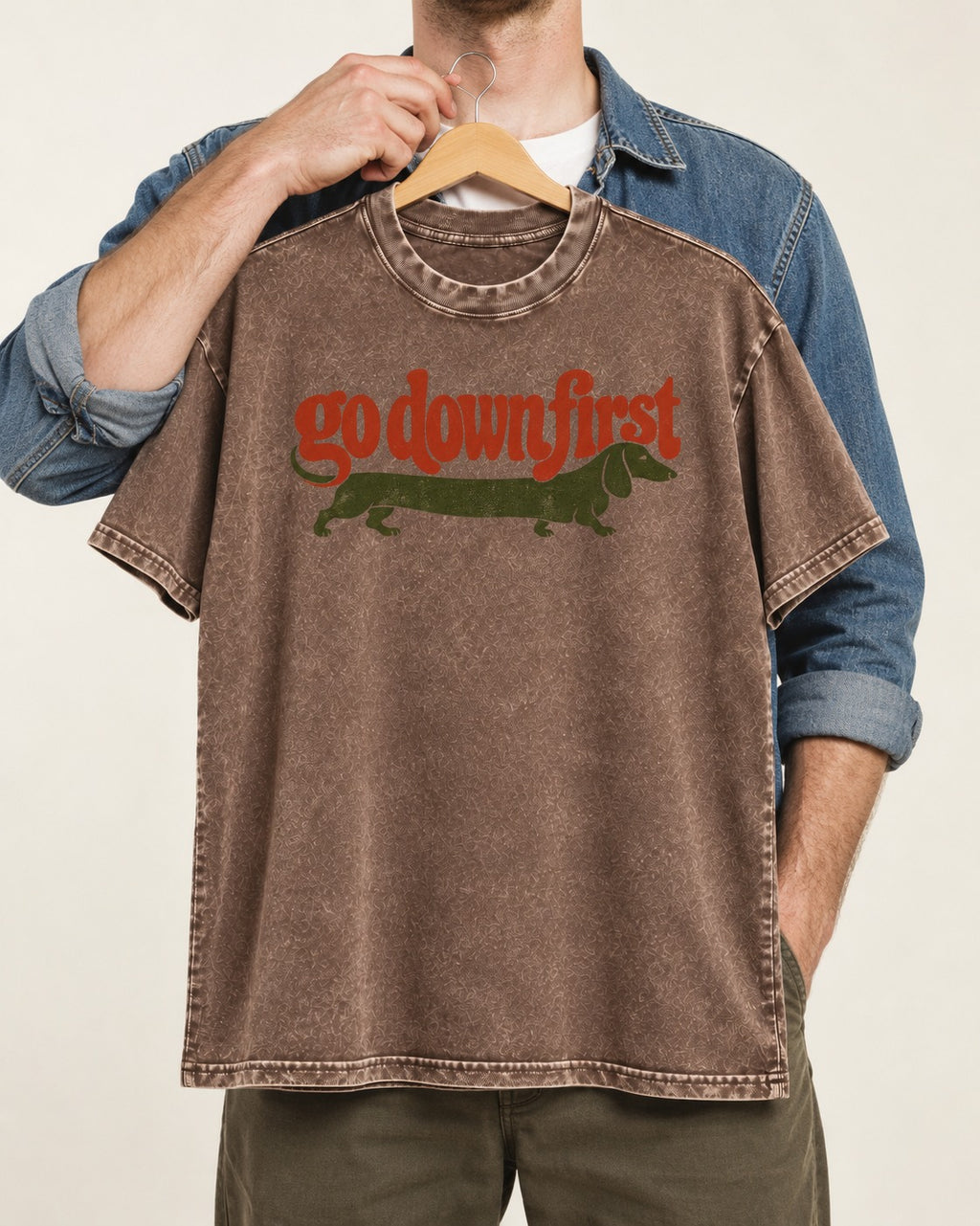 Dachshund Goes Down First Washed Tee in Coffee, held up on a hanger