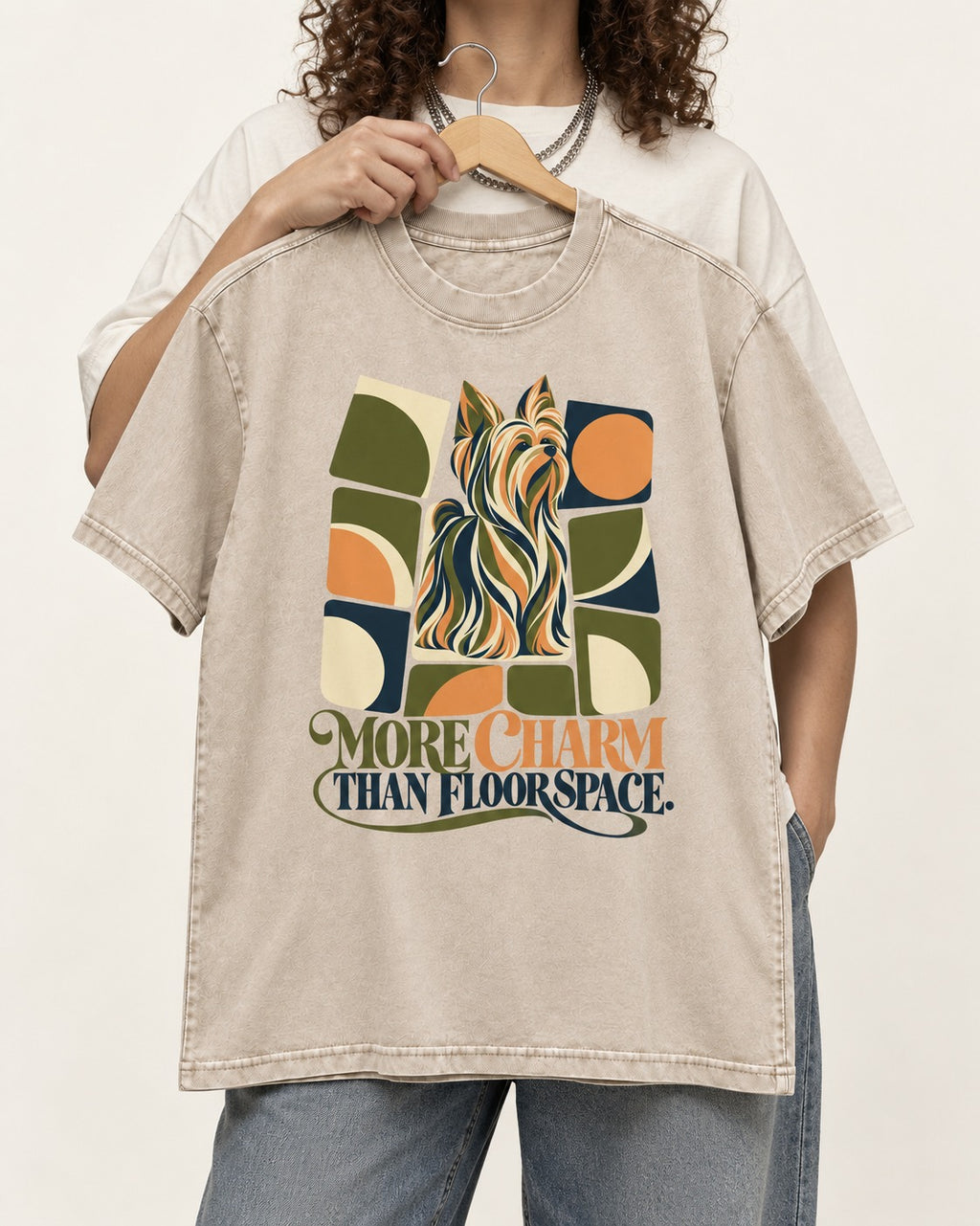Yorkshire Terrier More Charm Than Space Washed Tee in Apricot, held up on a hanger