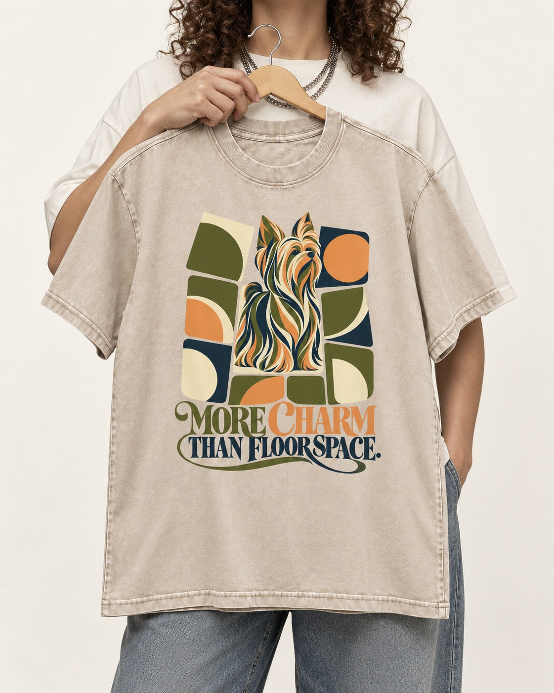 Yorkshire Terrier More Charm Than Space Washed Tee in Apricot, held up on a hanger