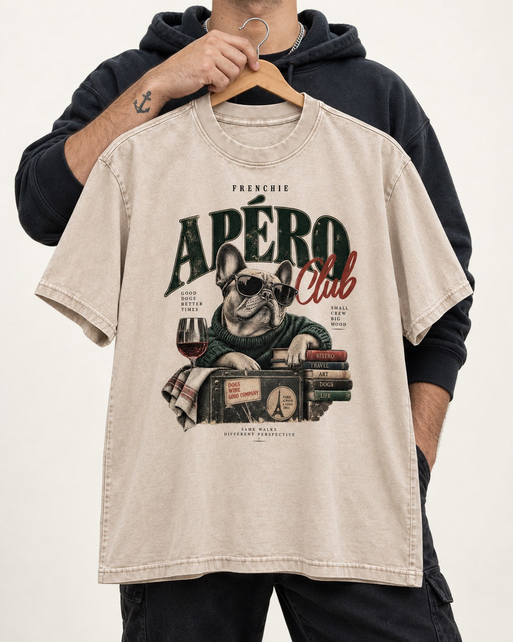 Frenchie Apero Club Washed Tee in Apricot, held up on a hanger