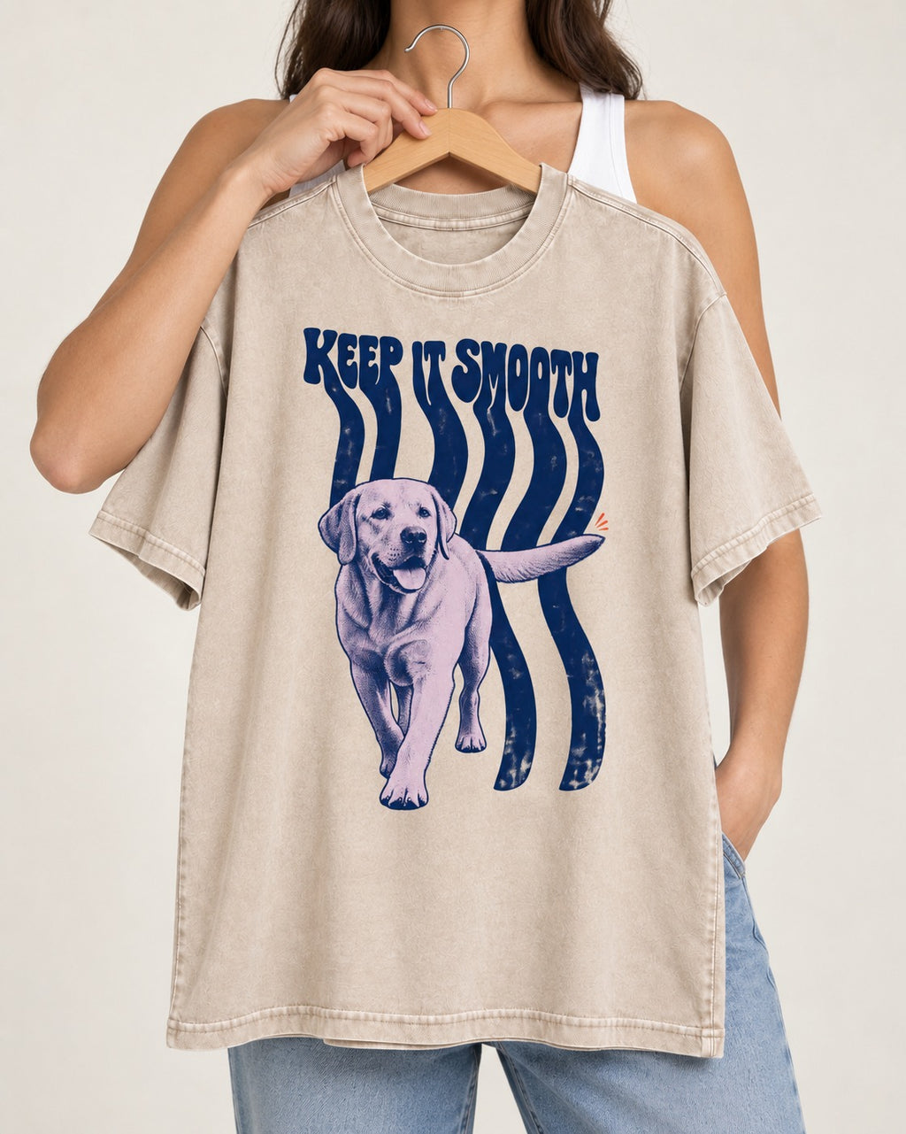 Keep It Smooth Labrador Retriever Washed Tee in Apricot, held up on a hanger
