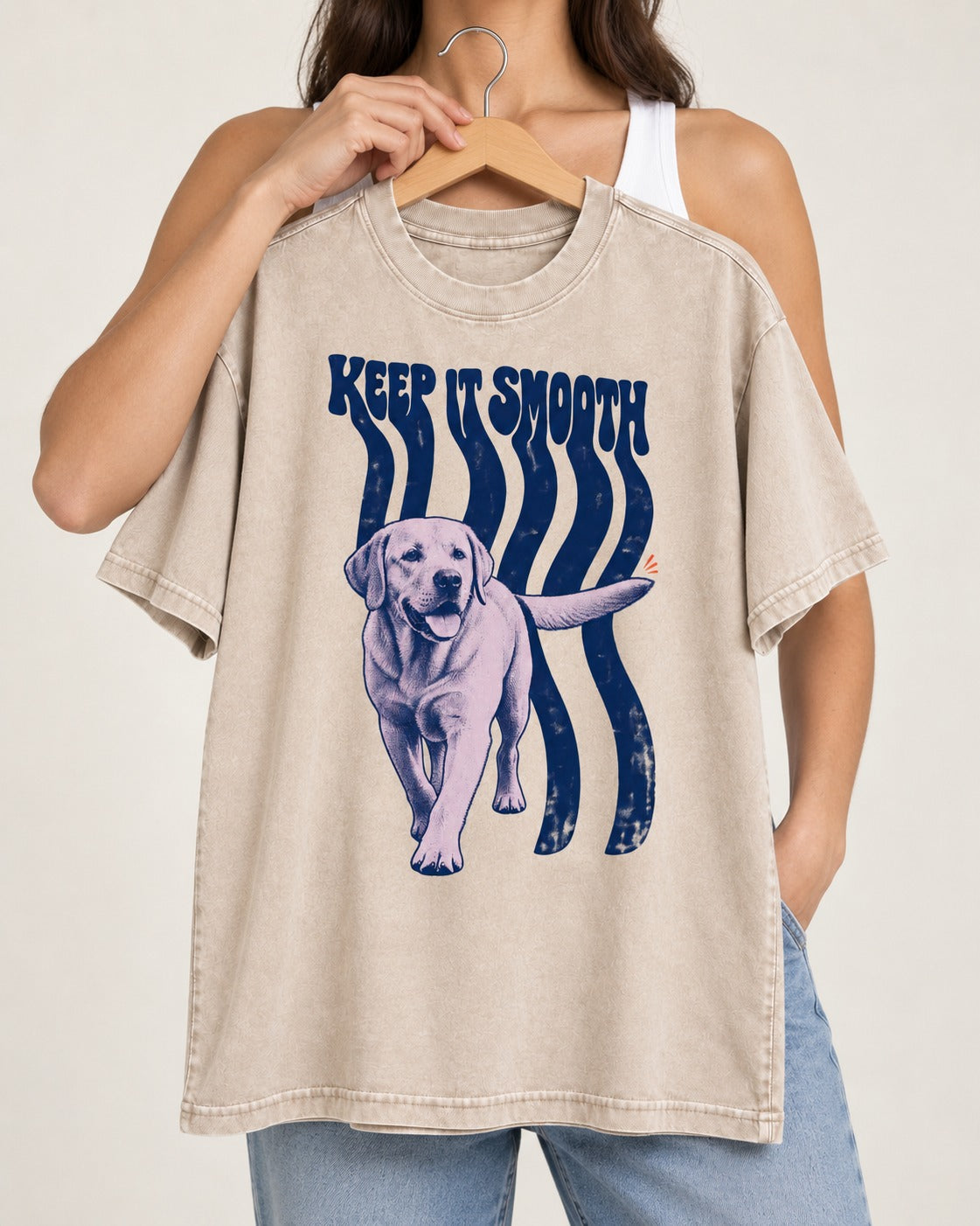Keep It Smooth Labrador Retriever Washed Tee in Apricot, held up on a hanger
