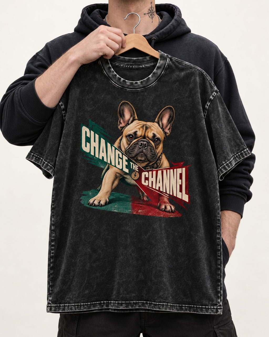 Frenchie Change the Channel Graphic Washed Tee in Black, held up on a hanger