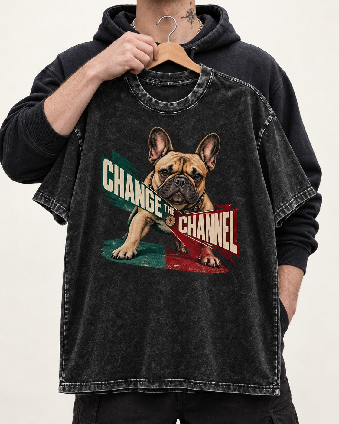 Frenchie Change the Channel Graphic Washed Tee in Black, held up on a hanger