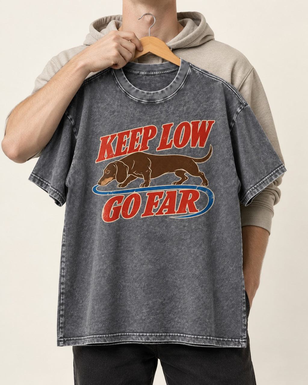 Dachshund Keep Low Go Far Washed Tee in Gray, held up on a hanger