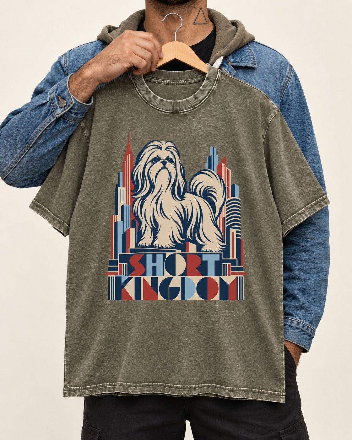 Shih Tzu Short Kingdom Art Deco Skyline Graphic Washed Tee in Army Green, held up on a hanger