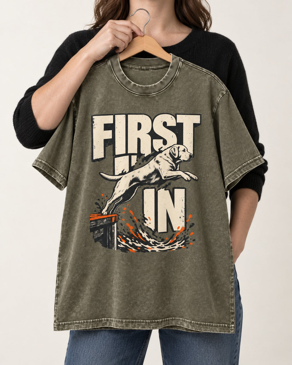 First In Dock Jump Labrador Retriever Graphic Washed Tee in Army Green, held up on a hanger