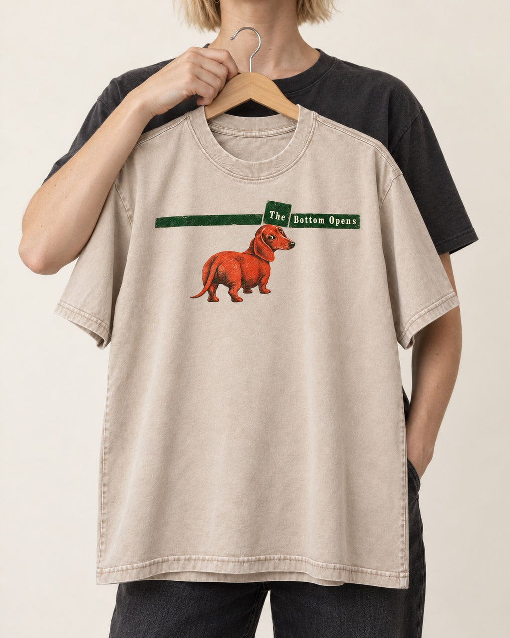Dachshund The Bottom Opens Signpost Graphic Washed Tee in Apricot, held up on a hanger