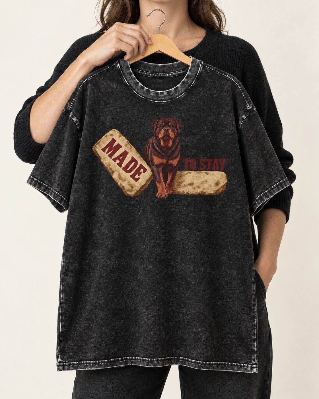 Rottweiler Made to Stay Stepping Stone Graphic Washed Tee in Black, held up on a hanger