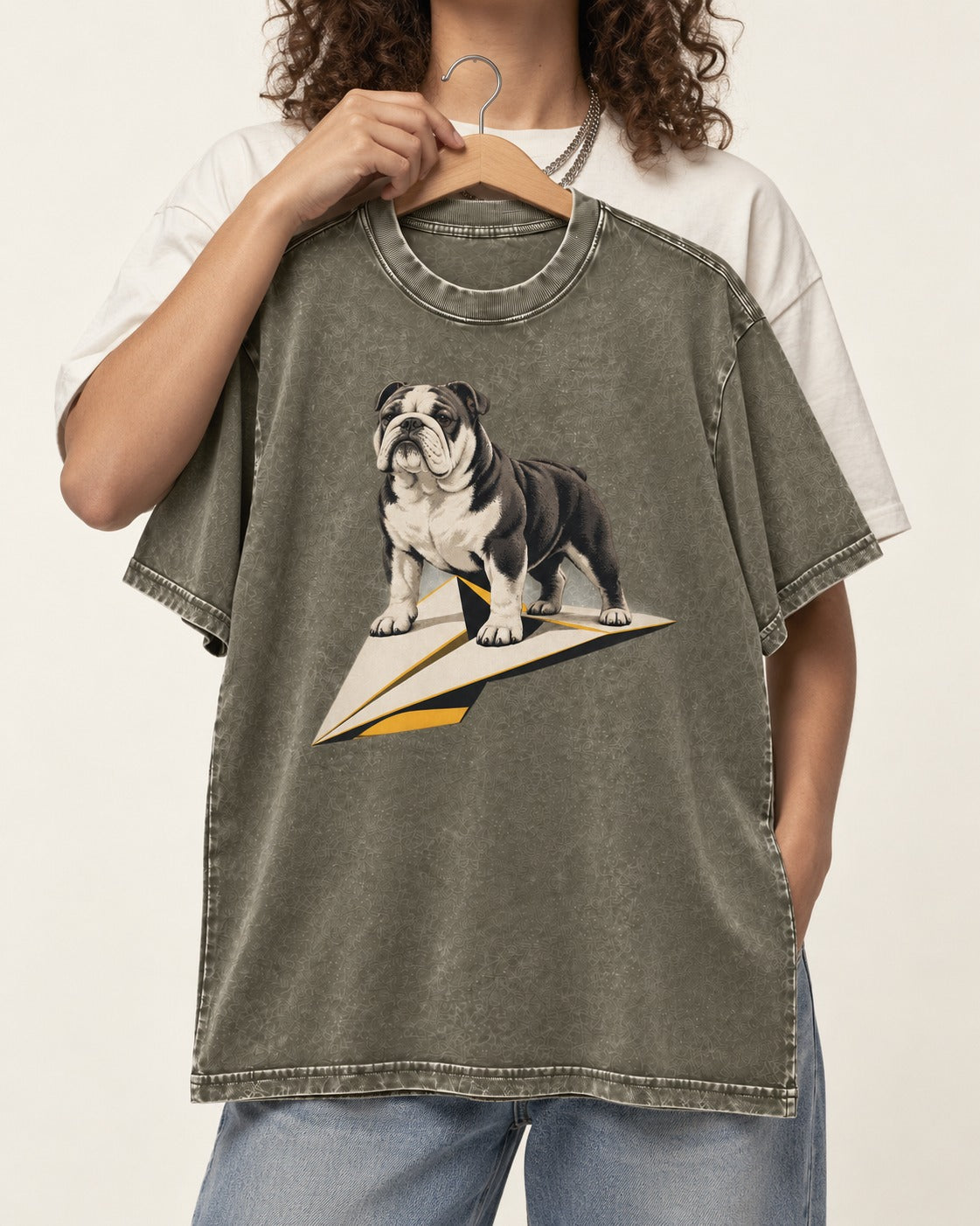 English Bulldog Paper Airplane Graphic Washed Tee in Army Green, held up on a hanger