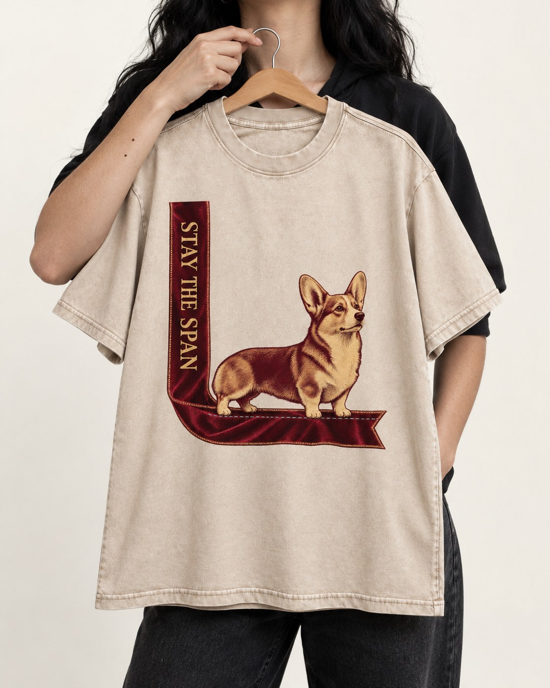 Corgi Stay the Span Ribbon Washed Tee in Apricot, held up on a hanger