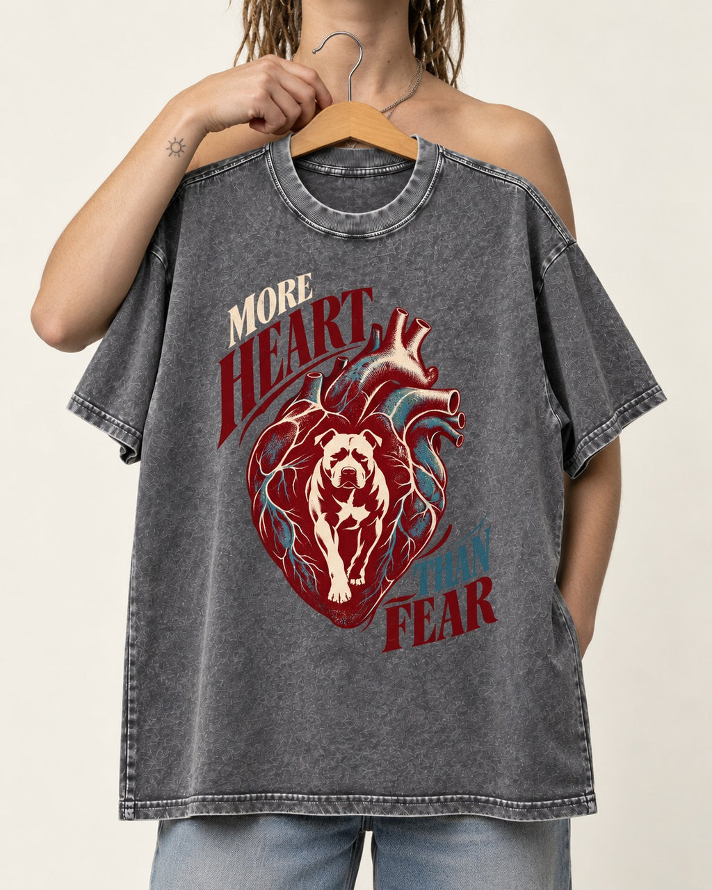Pitbull More Heart Than Fear Anatomical Heart Graphic Washed Tee in Gray, held up on a hanger