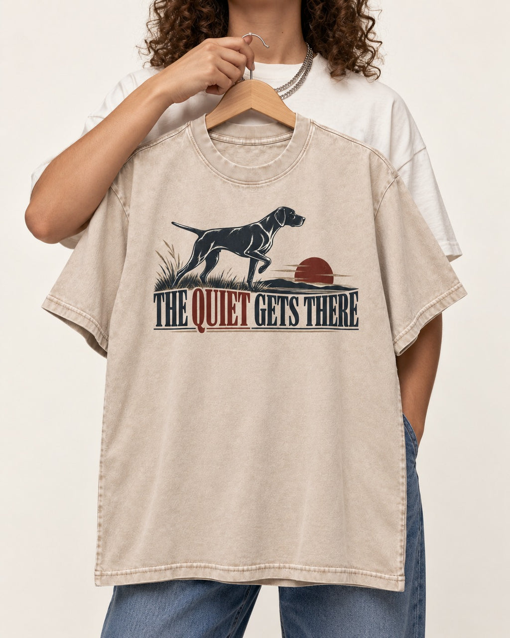 The Quiet Gets There German Shorthaired Pointer Washed Tee in Apricot, held up on a hanger