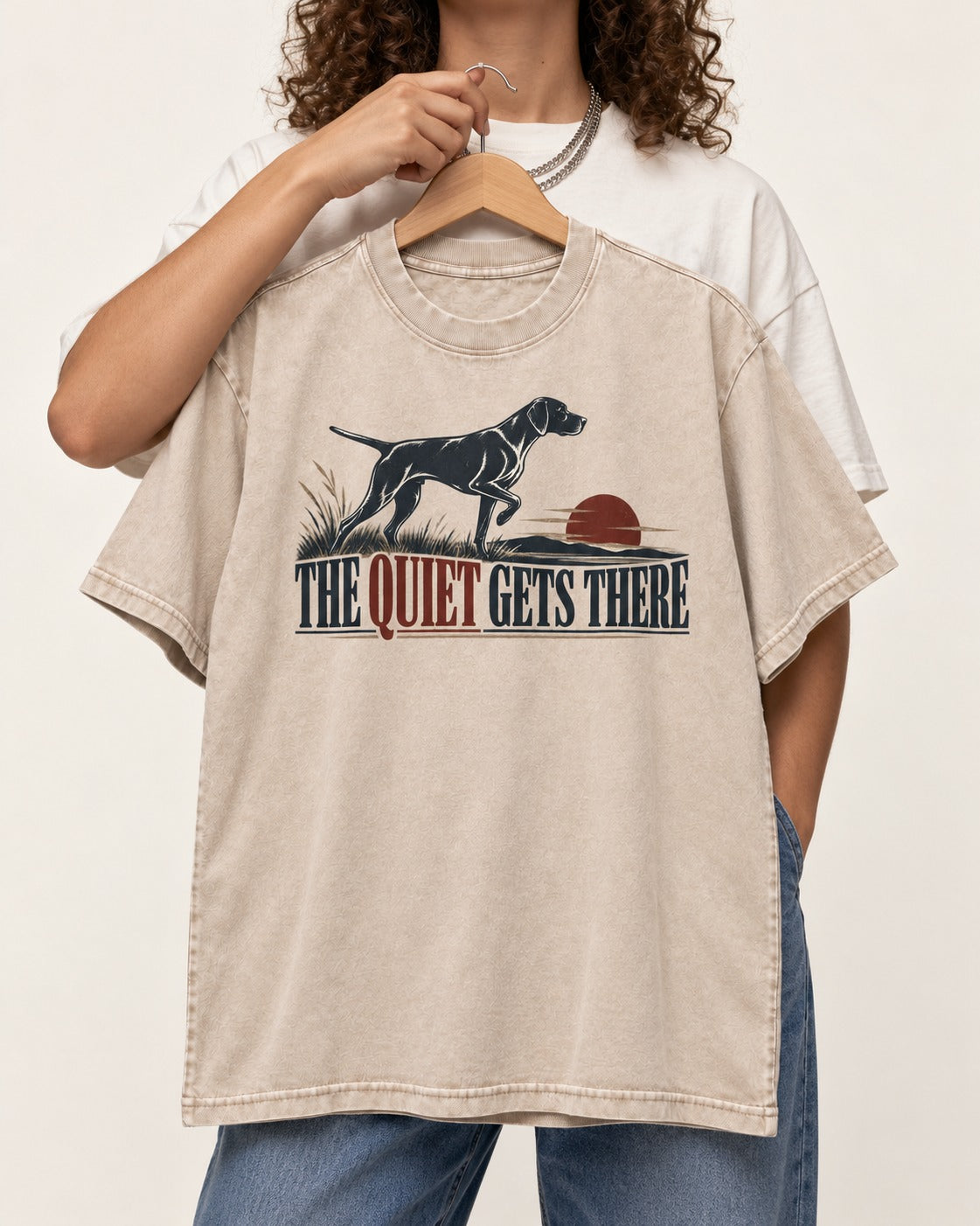 The Quiet Gets There German Shorthaired Pointer Washed Tee in Apricot, held up on a hanger