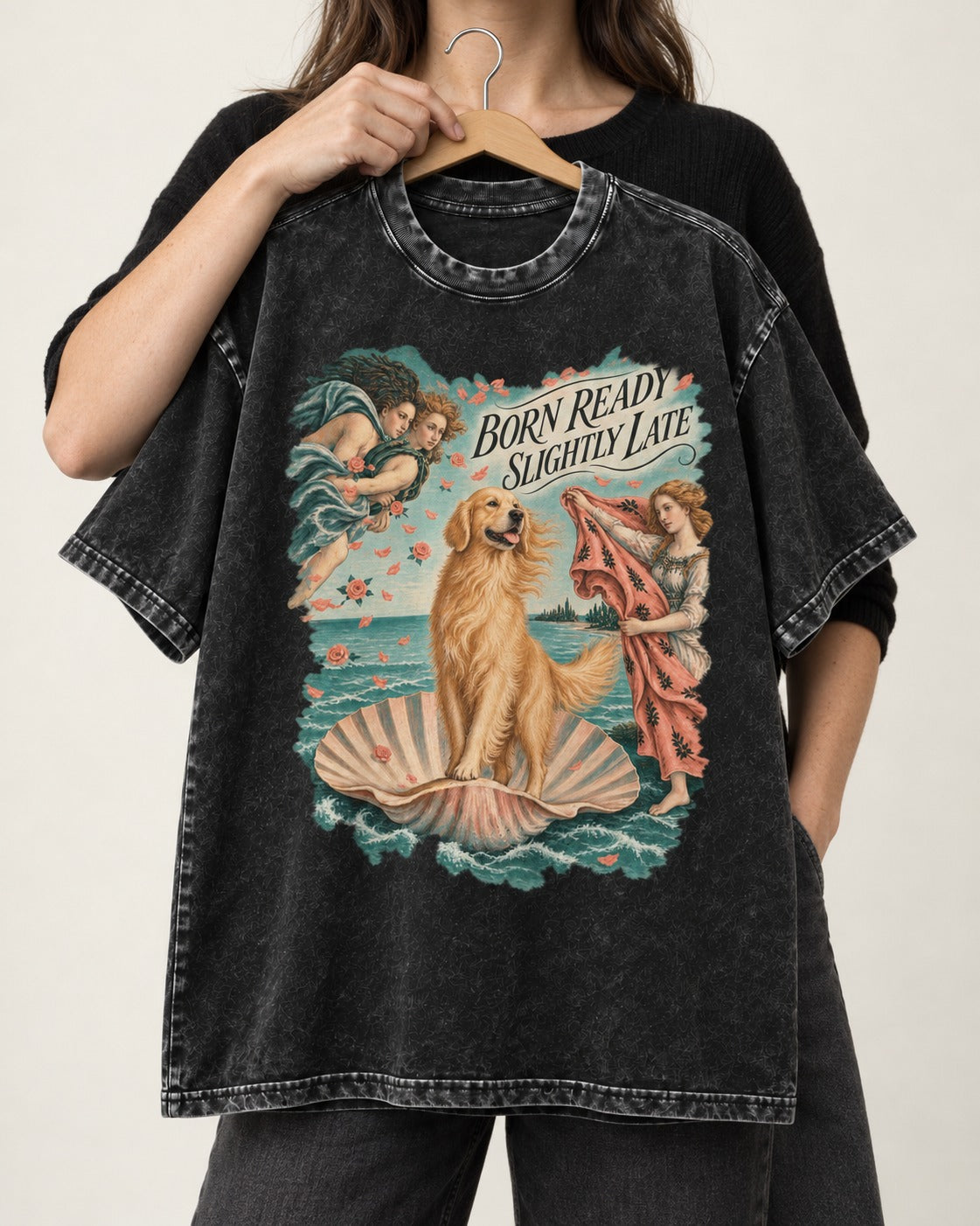 Born Ready Slightly Late Venus Golden Retriever Graphic Washed Tee in Black, held up on a hanger