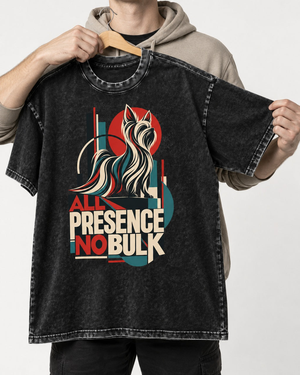 Yorkshire Terrier All Presence No Bulk Geometric Portrait Graphic Washed Tee in Black, held up on a hanger