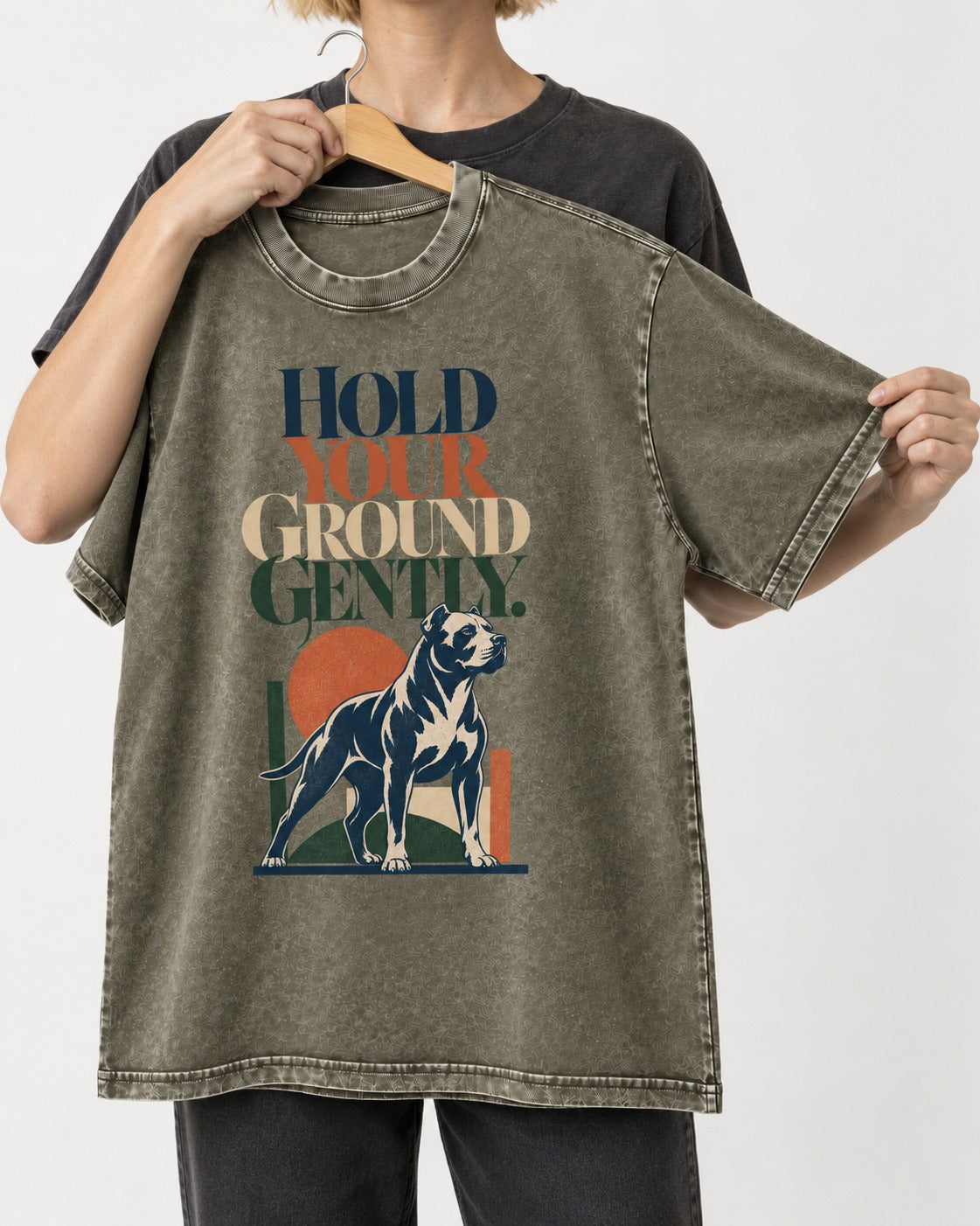 Pitbull Hold Your Ground Gently Standing Dog Graphic Washed Tee in Army Green, held up on a hanger