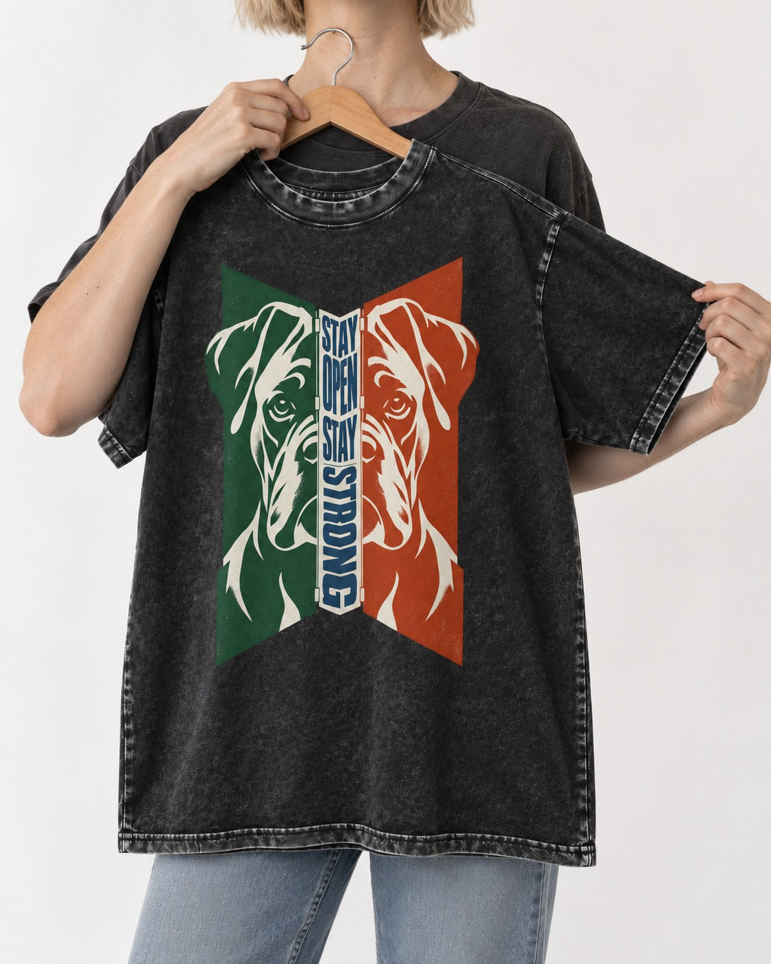 Boxer Stay Open Stay Strong Washed Tee in Black, held up on a hanger