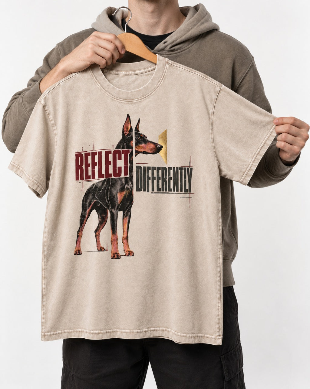 Doberman Reflects Differently Washed Tee in Apricot, held up on a hanger
