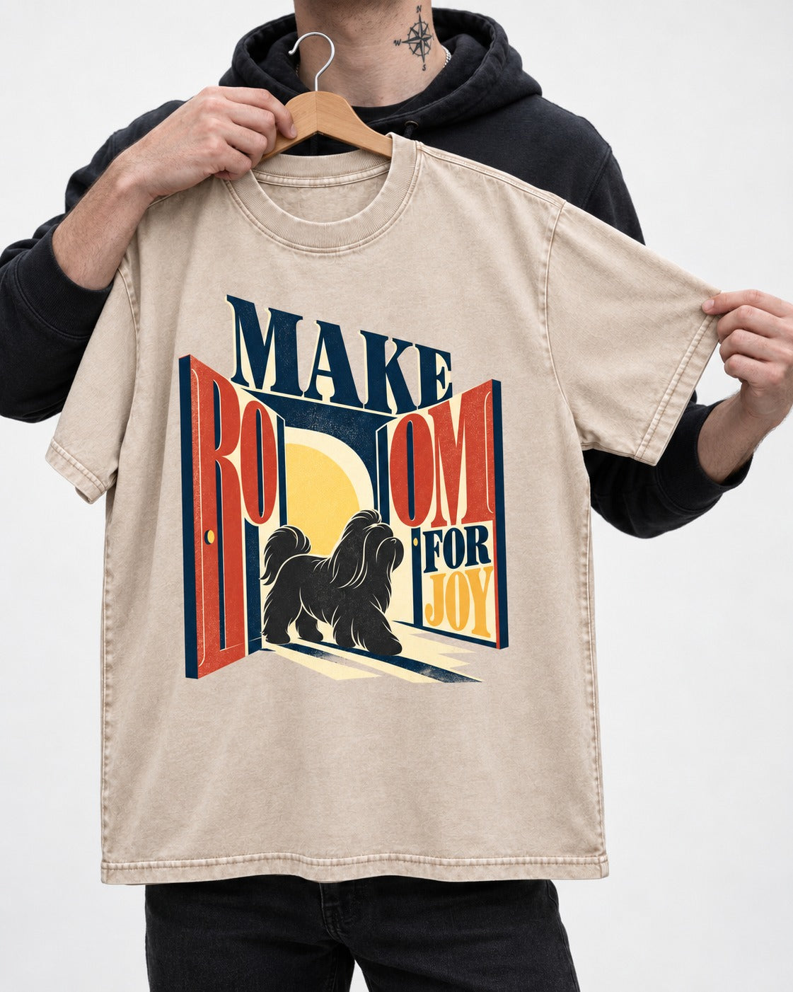 Shih Tzu Make Room for Joy Doorway Graphic Washed Tee in Apricot, held up on a hanger