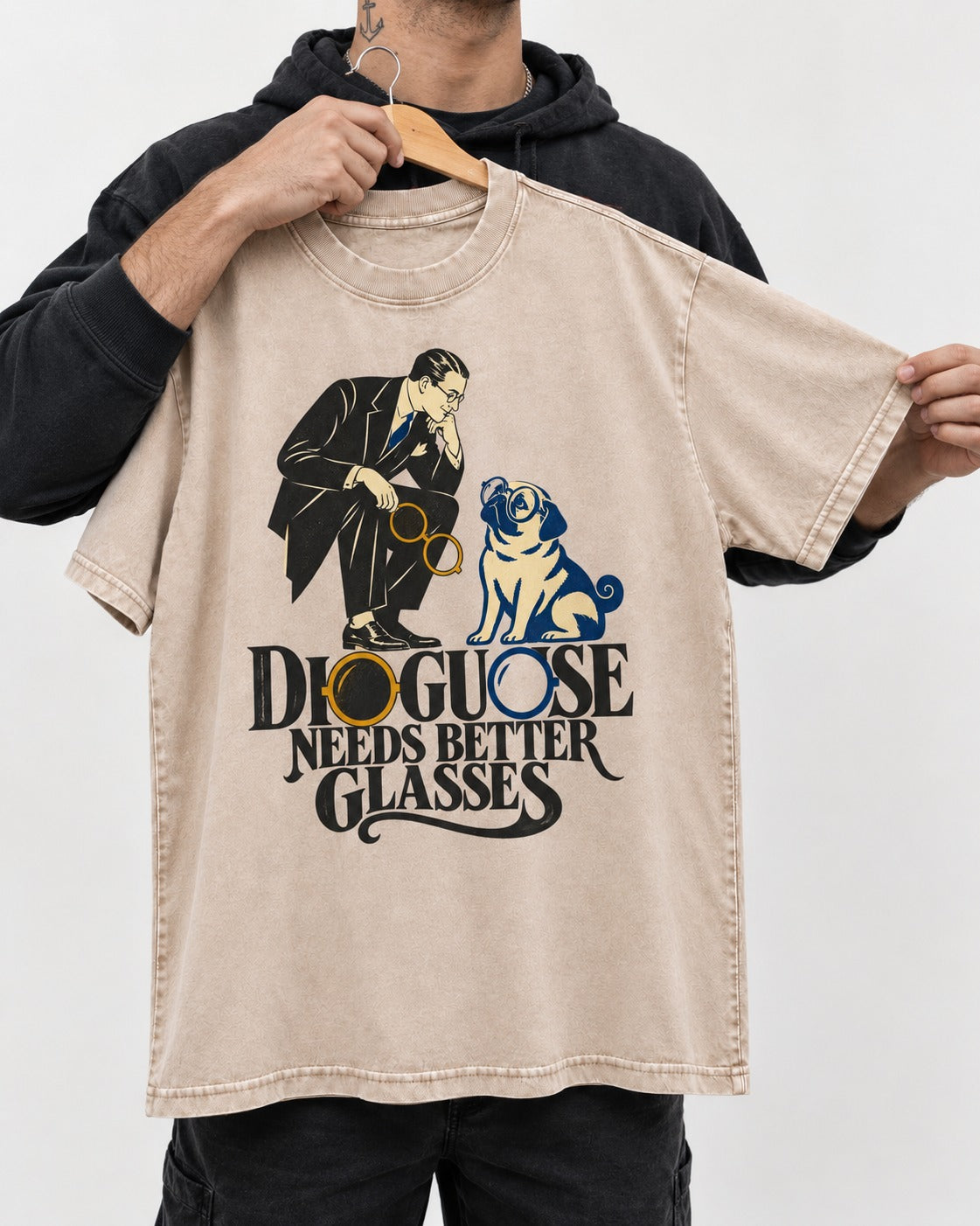 Pug Needs Better Glasses Washed Tee in Apricot, held up on a hanger
